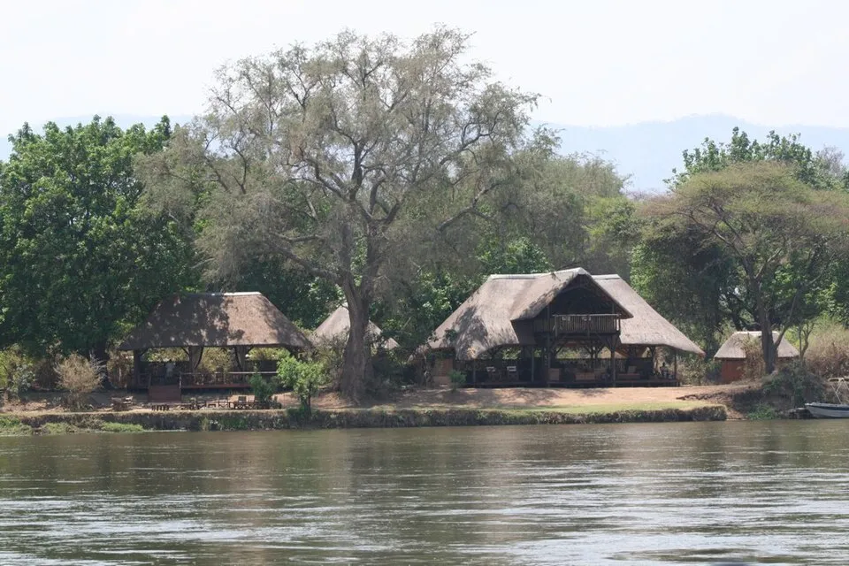 Thatched buildings of Chiawa Camp on the bank of the Zambezi River in Lower Zambezi National Park, photographed in 2009