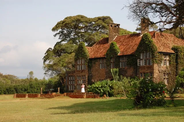 The ivy-covered brick front of Giraffe Manor and its lawn in Nairobi, Kenya, in 2008